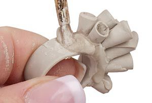 Clay cone being pressed onto ring